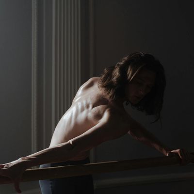 A gentle, elongated stretching pose shown in silhouette.